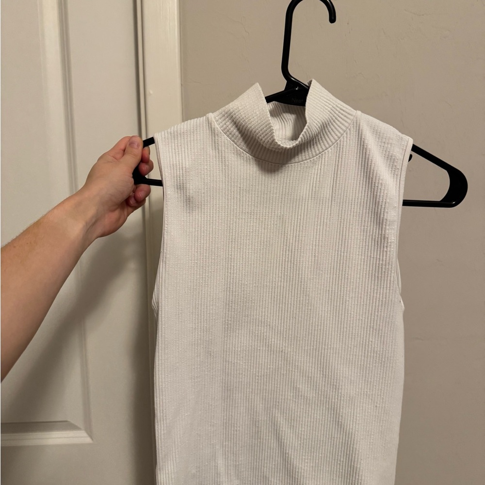 Sleeveless White Ribbed Turtleneck Top